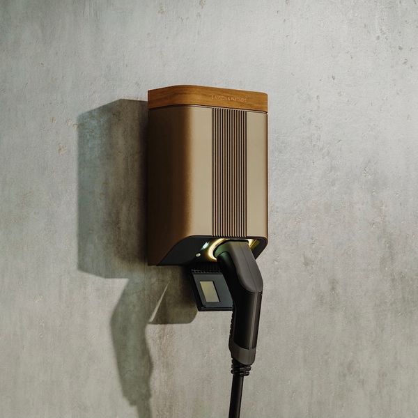  Simpson & Partners Home Series Charger, close up, tethered cable, on concrete wall with no car visible